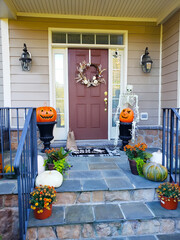 Porch decoration for a happy Halloween. Pumpkins, Skeletons and skulls are the traditional...