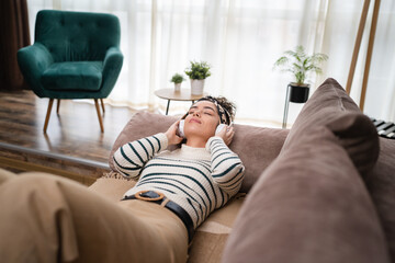 one woman doing guided meditation yoga self care practice at home