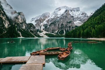 Scenic view of boats tethered on floating pier at Lake Braies boathouse, Italy