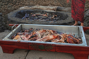 Pork cooked underground in the kalua tradition of Hawaii is shown just before being served as part of a luau meal in Hawaii.