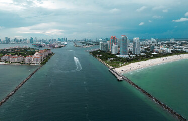 Fisher Island skyline with buildings seen from bay in South Beach. Miami Beach and Fisher Island aerial view. Luxury apartments on Fisher Island. Fisher Island from South Point Park Miami.