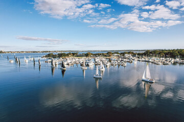 Yachts sailing into the Matilda Bay Marina on the Swan River in Perth
