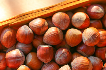  Hazelnuts in a basket on a wooden table. harvest of hazelnuts. Farmed organic ripe hazelnuts. 