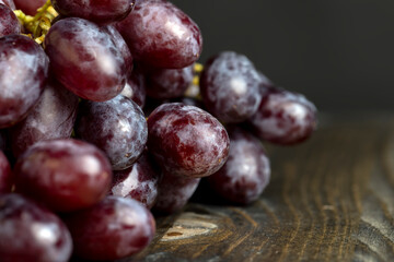 Ripe fresh grapes on a board