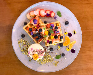 Tasty eggs Benedict on plate