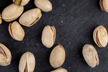 a large number of salty and crispy pistachios close-up
