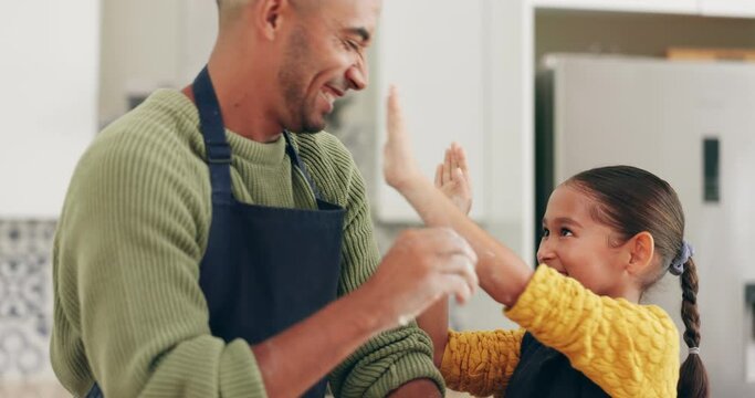 Father, daughter and cooking with flour, play and dirt on face, nose and comic laughing in family home. Dad, girl child and baking together with learning, funny game and happy in kitchen in house