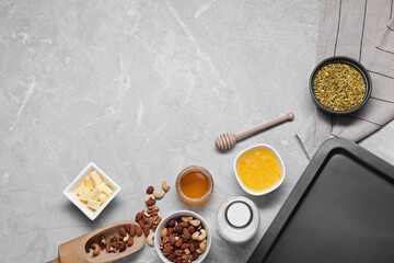 Ingredients for making delicious baklava on grey textured table, flat lay. Space for text