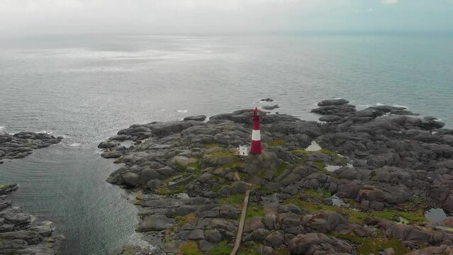drone flies over lighthouse on norwegian south coast Eigeroy Fyr