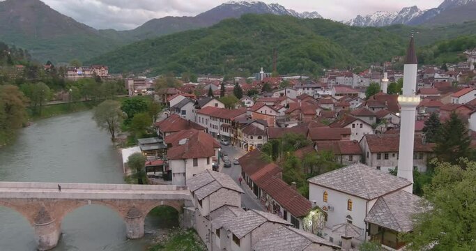 Aerial View of a Beautiful Bosnian Town on the Banks of the Neretva River in 4K