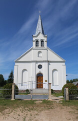 Fototapeta na wymiar Catholic church in Eglaine, Latvia with blue sky