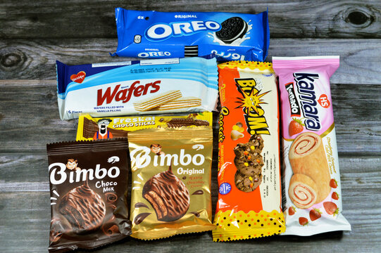 Cairo, Egypt, August 4 2023: collection of candy and sweets, Bisco Misr crispy creamy wafers, Oreo cookies, Kamara strawberry Swiss roll, Bimbo biscuit by Corona, Reese's cookies and Freska sticks