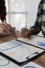 Young businessmen have business investment ideas in the conference room, they are having...