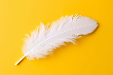 Obraz premium Close up of bright white feather. Copy space, yellow background. Fashion and Party concept. AI Generative
