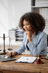 American woman is legal litigation attorney, Female lawyer is in a law firm drafting contracts and...