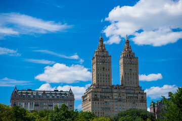 Fototapeta na wymiar Manhattan buildings from Central Park USA. view of the Manhattan building in central park. Central Park and the Upper East side in New York City. Park surrounded by skyscraper. urban architecture