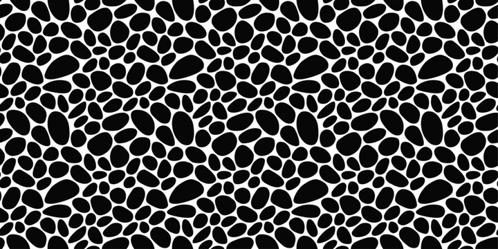 Seamless pebbles resembling a leopard skin. The black stones are rounded and provide texture. Pattern of black pebbles.