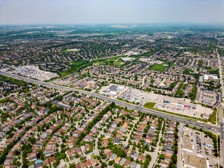 Obraz na płótnie Canvas Experience the town of Ajax from an unprecedented height with our captivating high-up drone view. This shot reveals the intricate layout of Ajax, its sprawling neighborhoods, 