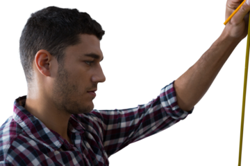 Digital png photo of caucasian male worker measuring on transparent background