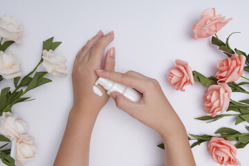 Moisturizing care skincare face cream for healing complicated troubled skin type. girl smears her hands cosmetic cream. skin care, elastic and young skin of the hands. flat lay, top view.