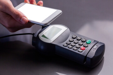 Digital png photo of hand paying with smartphone with copy space on transparent background