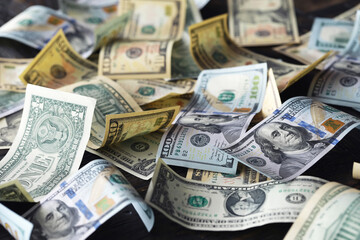 Money, US dollar bills background. Money scattered on the desk. Photography for Finance and Economy concepts.