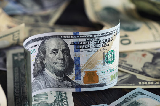 Money, US dollar bills background. Money scattered on the desk. Photography for Finance and Economy concepts.