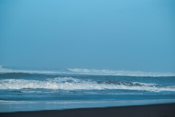 The wave in the sea with blue sky background in Yogyakarta, Indonesia