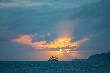 Small French Polynesia island and a stunning sunrise