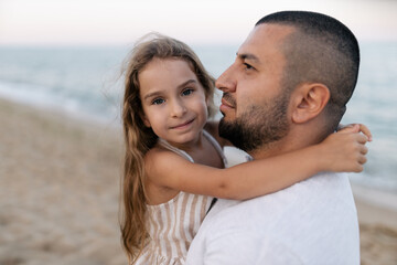 Fototapeta premium Little girl hugging her dad