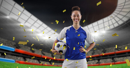 Image of biracial female soccer player over stadium