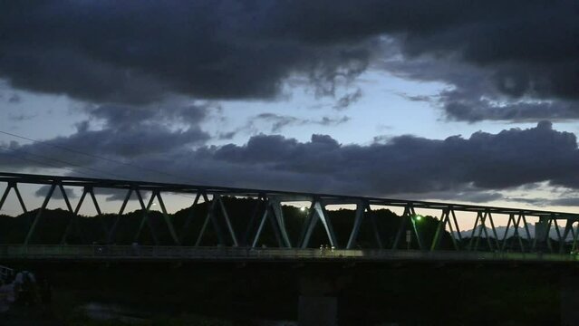 Video of the bridge over the river in the evening Pan