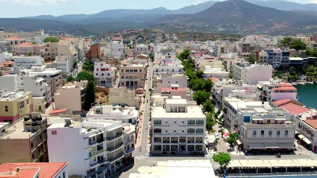 Slow motion aerial view of the center of the city of Agios Nikolaos on the Greek island of Crete.