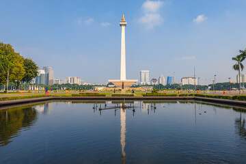 Obraz premium July 12, 2023: National Monument standing in the middle of the Merdeka Square, a large square located in the center of Jakarta, Indonesia