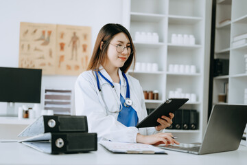 Medicine Asian doctor hand working with modern digital tablet computer interface as medical network...