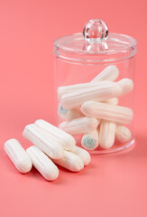 Women hygienic tampons in the containers