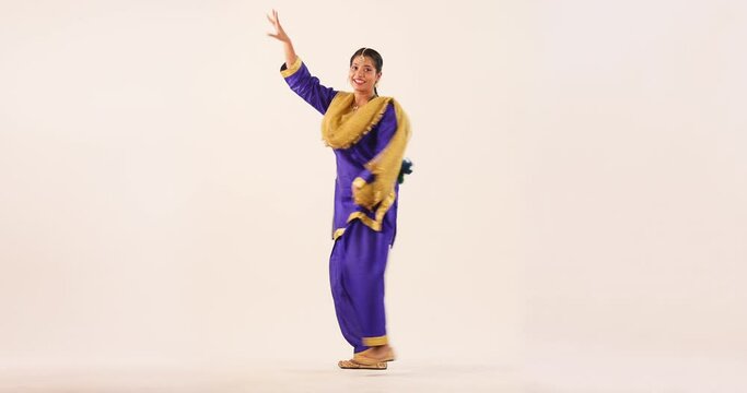 Sikh Woman performing bhangra during Baisakhi Celebration