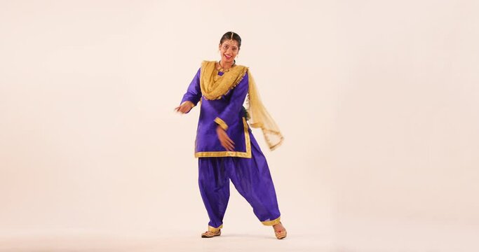 Sikh Woman performing bhangra during Baisakhi Celebration