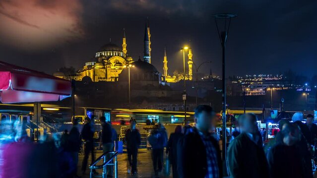 Istanbul at night street square eminonu timelpase in bachkground mosque at night, istanbul urban scene at night, turkey istanbul.