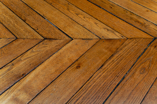 wood planks from an old fishtail parquet floor 