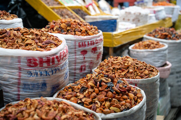 Stand of dried fruits in Osh Bazaar, Bishkek, Kyrgyzstan. The dessert in the Osh bazar market at...