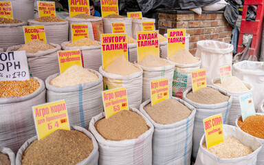 Stand of dried fruits in Osh Bazaar, Bishkek, Kyrgyzstan. The dessert in the Osh bazar market at...