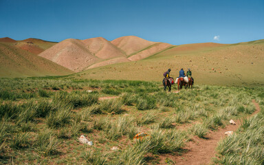 Nomadic couple and their horse in the mountains near Bishkek, Kyrgyzstan.