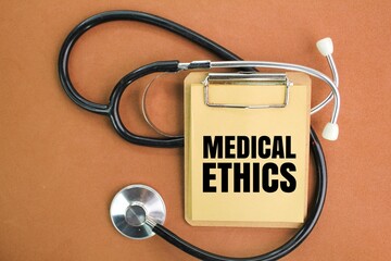 stethoscope and writing board with the word Medical Ethics. concept of medical ethics