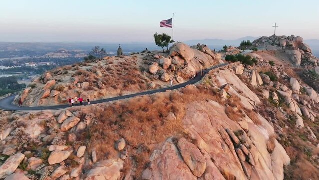 mt rubidoux in riverside california at sunset with people hiking in view - AERIAL TRUCKING PAN
