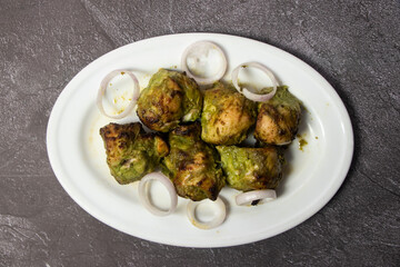 Chicken Hariyali tikka boti Kabab served in dish isolated on background top view of bangladesh food