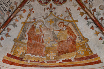 Mary and Christ sit side-by-side on a wide throne, a romanesque wall-painting in Ringsted St. Bendt church