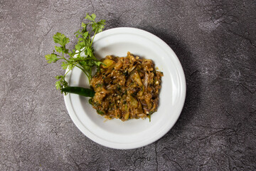 Begun Bhorta or mashed eggplant served in dish isolated on background top view of bangladesh food