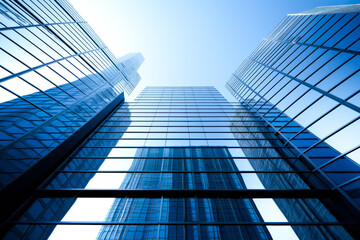Obraz premium Generic blue modern building in city. Symbol of success and business. Urban concept.