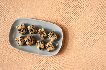 sushi is a Japanese dish of prepared vinegared rice, usually with some sugar and salt, accompanied by a variety of ingredients such as seafood, often raw and vegetables.